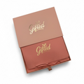 Letterbox gift for women and girls. Velvet pouch. Create your own letterbox beauty gift. Gifted pink box with gold text on a white background